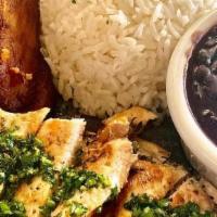 Chimichurri Chicken (Ol) · Grilled chicken breast, topped with chimichurri sauce served rice & beans or maduros & salad