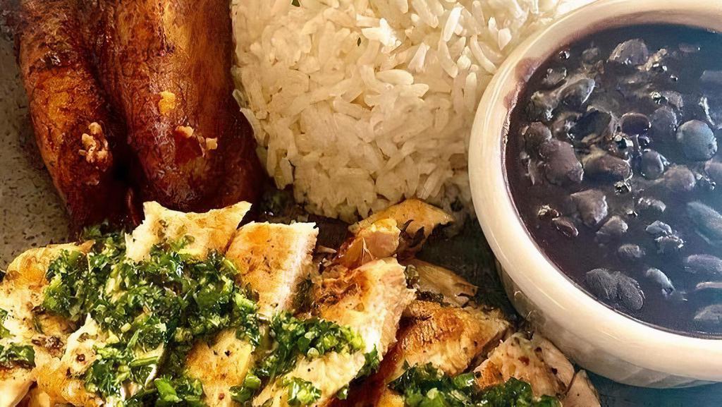 Chimichurri Chicken (Ol) · Grilled chicken breast, topped with chimichurri sauce served rice & beans or maduros & salad