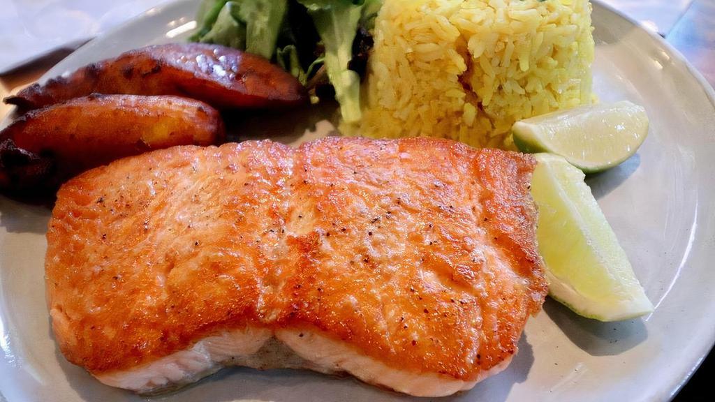 Grilled Salmon (Ol) · Grilled atlantic salmon, served with garlic rice, maduros and house salad