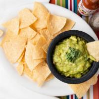 Guacamole Appetizer · Homemade mashed avocado dip with onion, cilantro, lime, peppers and tomato. Served with 1 ba...