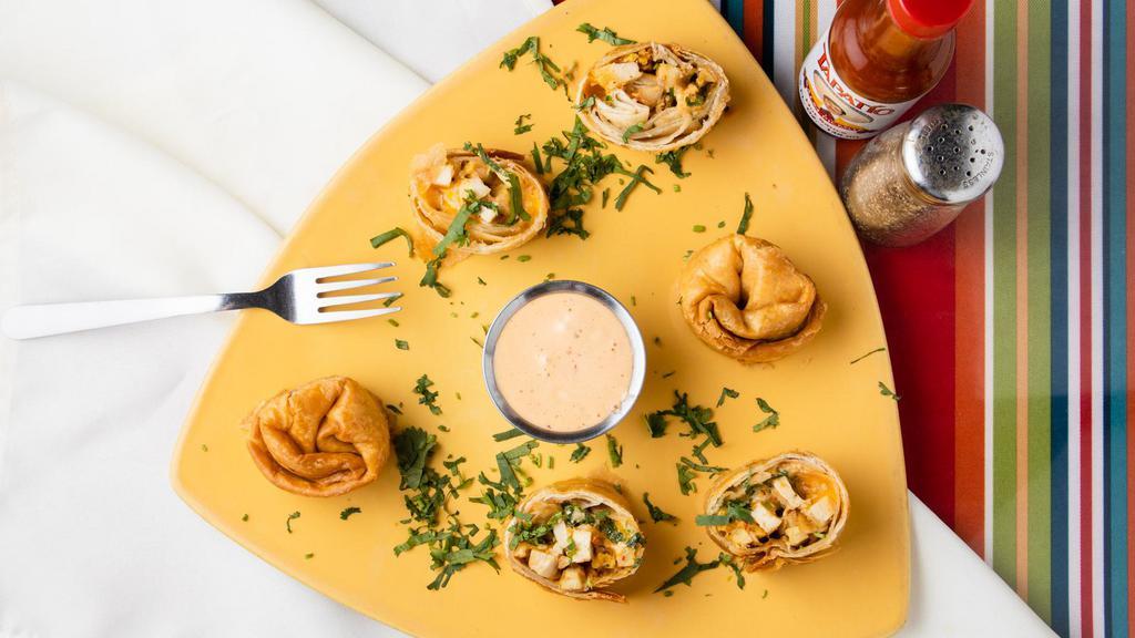 Chipotle Chicken Chingalinga (6 Pc) · Chipotle seasoned chicken and cheese rolled in a flour tortilla and deep fried. Garnished with cilantro and served with chipotle ranch dressing.