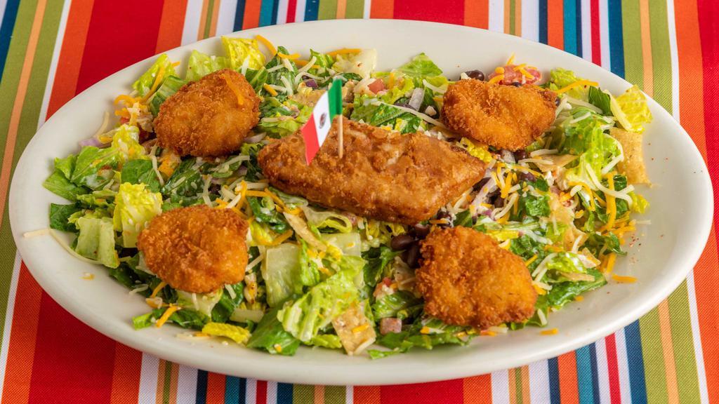 Crunchy Seafood Salad · Fried shrimp and/or battered fish atop a bed of romaine lettuce, cucumber and pico de gallo tossed in a spicy chili lime ranch dressing and topped with Parmesan and Cotija cheeses.