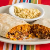 Texas Burrito · A delicious and filling burrito with sauteed onions, fried potatoes, Mexican rice, black bea...
