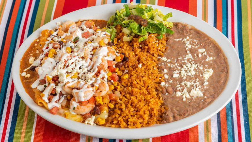 The Whole Enchilada · Two cheese enchiladas in red sauce and topped with your choice of steak, Chicken or shrimp. Garnished with black beans, corn, pico de gallo, cotija cheese, sour cream and cilantro. It's a fiesta in your mouth.