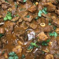Curry Goat · Cubed goat meat in our famous family curry sauce.