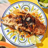 Escovitch · Fried snapper with spicy peppers and onions.