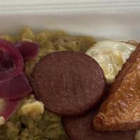 Mangu Con Los Tres Golpes · Mashed plantains with fried eggs, fried cheese, and fried salami.
