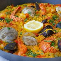 Seafood Paella · seafood combination with, mussels, clams, shrimp, and calamari cooked with saffron rice