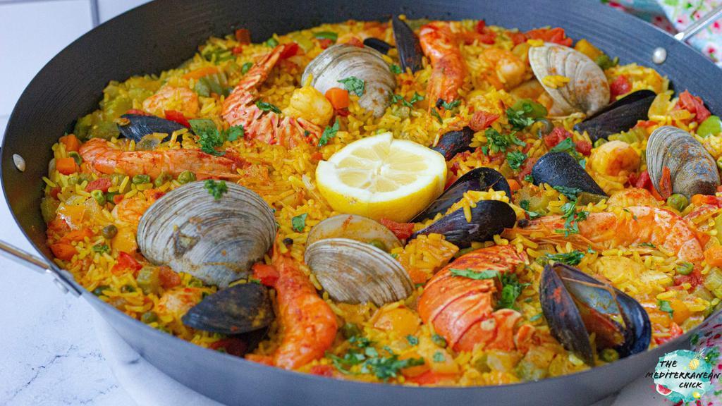 Seafood Paella  · seafood combination of, clams, mussels, shrimp and calamari