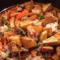 Portuguese Mix Meat (Picadinho) · mix meat combination with sauté potatoes and garlic sauce