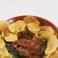 Steak  In Garlic Sauce (Bitoque)) · served with   potato chips and fired egg