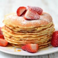 Strawberry Pancakes · Delicious, hot buttermilk pancakes cooked to perfection. Topped with fresh strawberries.