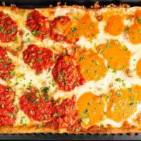 Grandma Pie · Thin crust Square pizza brushed with olive oil and garlic, fresh mozzarella, and spotted wit...