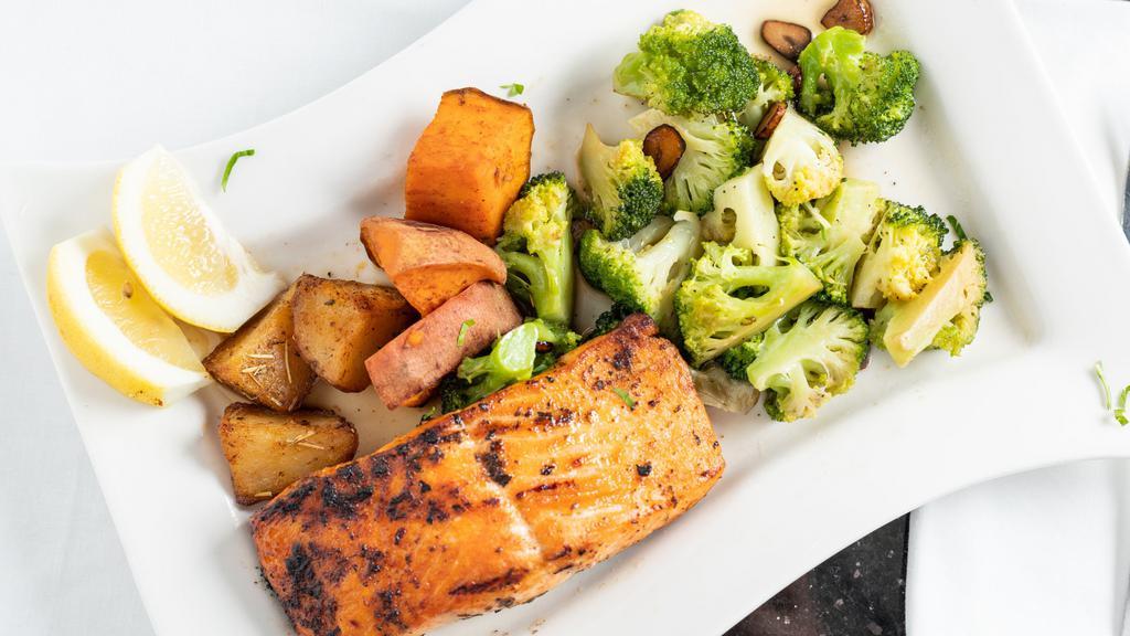 Grilled Salmon · Served with sauteed broccoli, sweet & roasted potatoes.