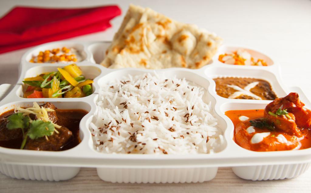 Non-Vegetarian Thaali · Chicken, goat/lamb, vegetable, daal, basmati rice, naan/roti, yogurt, dessert.