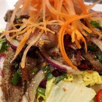 Thai Spicy Beef Salad · Hot. Grilled marinated NY steak with onion, scallion, celery, tomato, lime juice, chili.