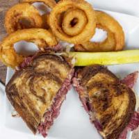 Reuben Sandwich · Grilled rye, Russian, Swiss and kraut. Served choice of crispy french fries, sweet potato fr...