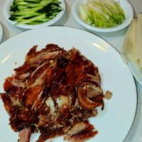 Beijing Sliced Duck · With pancakes, scallon, shredded cucumber.