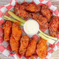 Chicken Wings · Served with blue cheese dressing and celery sticks.