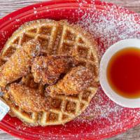 Waffles And Wings · Served with warm maple syrup.