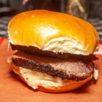 Beef Brisket (Sliced) Sandwich · Sliced Texas-style beef brisket.  Served on a roll with coleslaw, pickles, onions, and a cho...