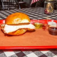 Smoked Turkey Sandwich · Smoked turkey breast.  Served on a roll with coleslaw, pickles, onions, and a choice of BBQ ...