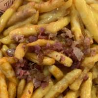 Bacon Cheese Fries · Coated Crispy Fries, Nacho cheese, Bacon end pieces.