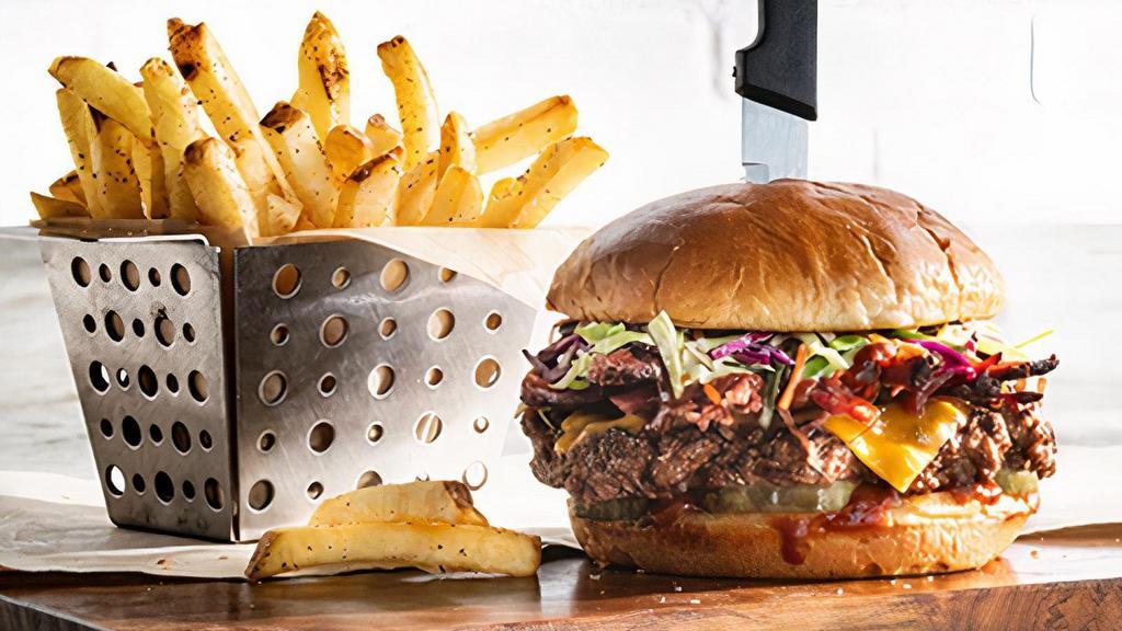 Bbq Brisket Burger* · Brisket, house BBQ, cheddar, pickles, coleslaw.