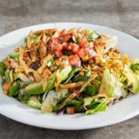Santa Fe Chicken Salad · Spicy grilled chicken, pico, avocado, cilantro, tortilla strips, house-made ranch & a drizzl...