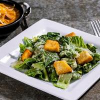 Soup & Caesar Salad · A delicious bowl of Soup with a Caesar Salad.