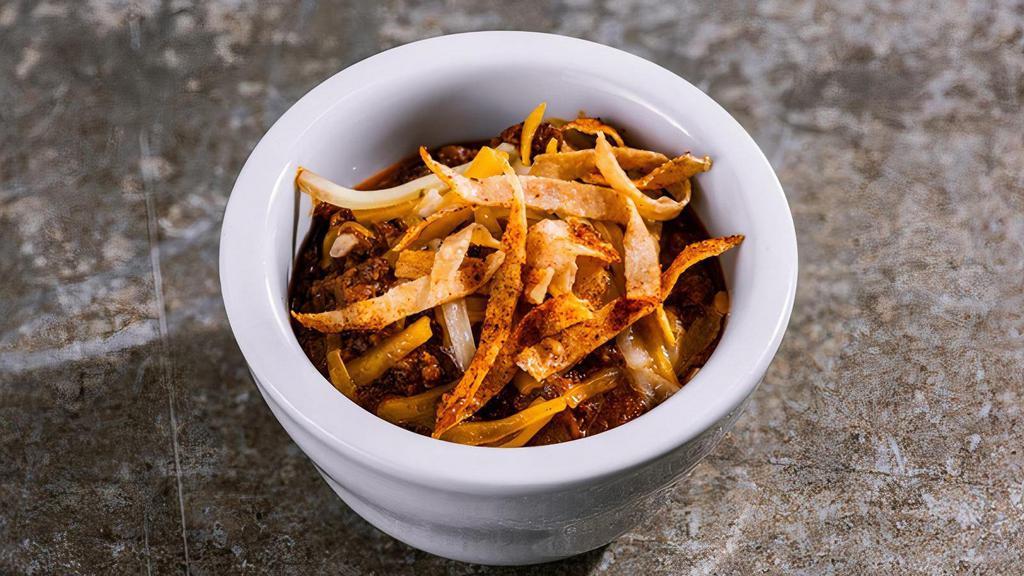 Cup Of The Original Chili · Yeah, chili is our thing. Our original recipe, filled with beef, onions & signature blend of spices. Topped with shredded cheese & tortilla strips.