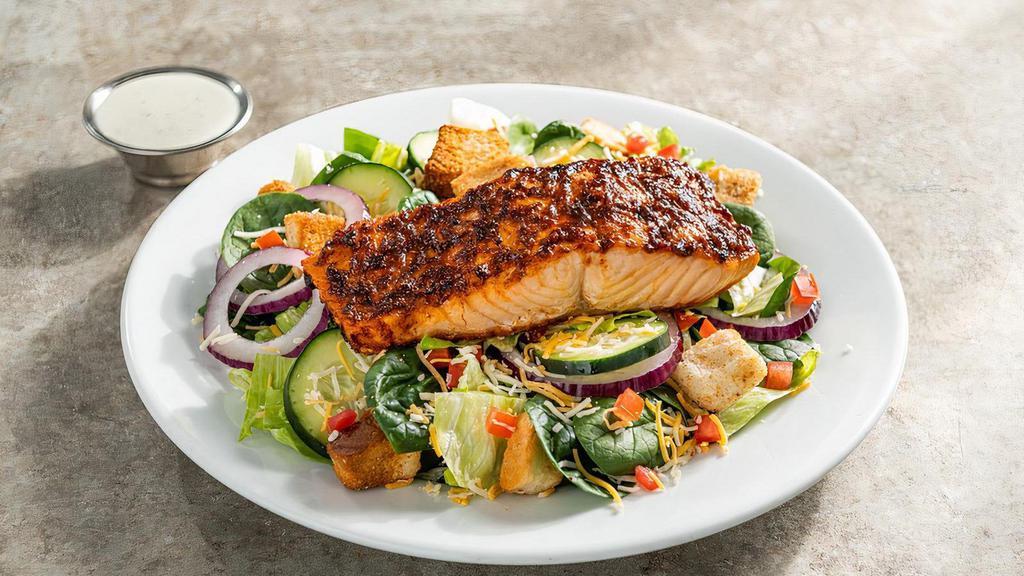 Ancho Salmon House Salad · Seared chile-rubbed Atlantic salmon, tomatoes, red onion, cucumber, shredded cheese, garlic croutons with choice of dressing.
