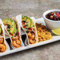 Spicy Shrimp Tacos · Three spicy chile-lime shrimp tacos in flour tortillas with pico, avocado, cilantro, colesla...