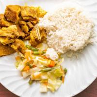Curry Goat · Served with white rice or peas and vegetables.