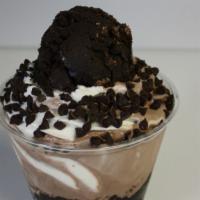 Triple Chocolate Brownie Doughnado · Triple Chocolate Cookie Dough layered between soft serve ice cream topped with chocolate chi...