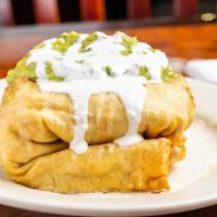 Chimichangas Burrito · Fried tortilla with rice, beans and meat. Made with cheese, cilantro, onions, rice, beans, g...