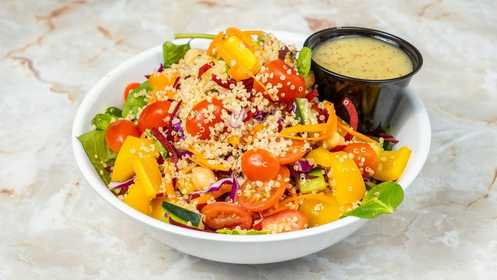Quinoa Salad · Mixed greens, quinoa, chickpeas, carrot, cucumber, cherry tomato, beets, bell pepper, red cabbage and lemon poppy dressing.