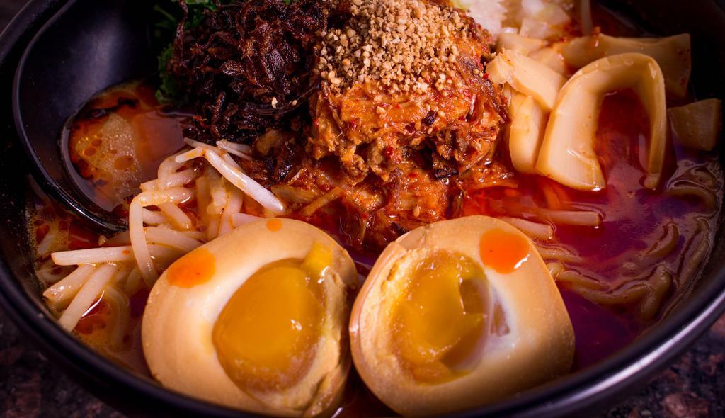 Hot & Spicy Ramen · Braised pork, egg, sesame, onion, nori seaweed, bamboo, kale, chili oil, roasted onion flakes.