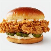 The Classic Chicken Sandwich · 6 oz fried chicken breast, dill pickle chips, and chicken sauce on a brioche bun.