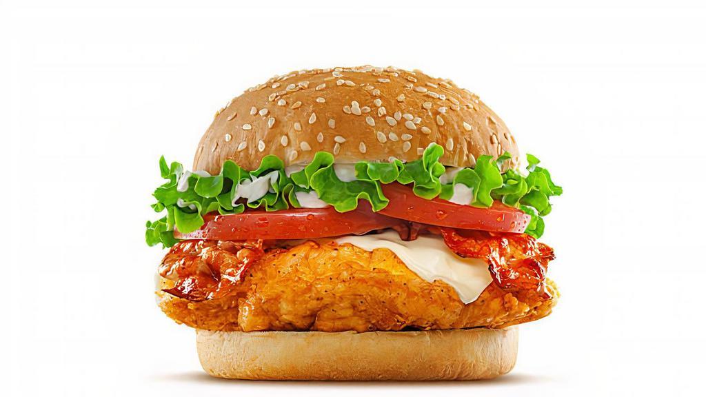 Cheesy Chicken Sandwich · Fried chicken breast, Cheddar cheese, bacon, lettuce, tomato, and chicken sauce on a brioche bun.