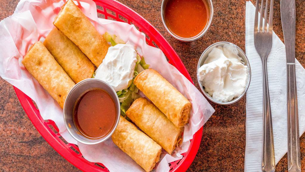 Taquitos · 3 pieces. Fried rolled tortillas stuffed with beef and cheese or chicken and cheese. Served with lettuce, pico de gallo and sour cream.