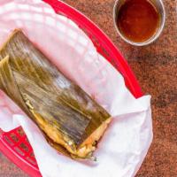 Tamales Salvadorenos · Steamed corn mix tamale stuffed with chicken, potatoes, garbanzo beans and rice. Comes wrapp...