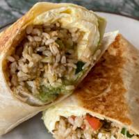 Breakfast Burrito · soft scrambled eggs, cheddar cheese, house-made salsa, brown rice and guacamole on a griddle...
