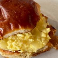 The Egg & Cheese · Soft scrambled eggs and cheddar on a toasted brioche bun. [FOR GLUTEN FREE: Only GF wraps or...