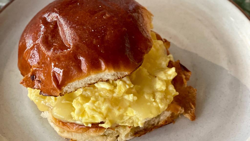 The Egg & Cheese · Soft scrambled eggs and cheddar on a toasted brioche bun. [FOR GLUTEN FREE: Only GF wraps or sliced GF bread available / No BUNS!]