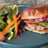 Turkey Burger · House-made turkey burger with lettuce, tomato, pickled slaw, and lemon herb aoili on a toast...