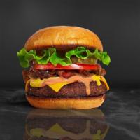 Classic Manic Burger · American beef patty topped with lettuce, tomato, and mayo. Served on a warm bun.