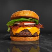 Baby Bacon Burger · American beef patty topped with melted cheese, layers of crispy bacon, lettuce, tomato, onio...
