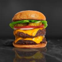 I'Ll Take Two Cheese Burger · Two American beef patties topped with melted cheese, lettuce, tomato, onion, and pickles. Se...