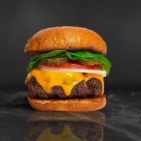 Cheese Tripper Burger · American beef patty topped with American cheese, lettuce, tomato and mayo. Served on a warm ...